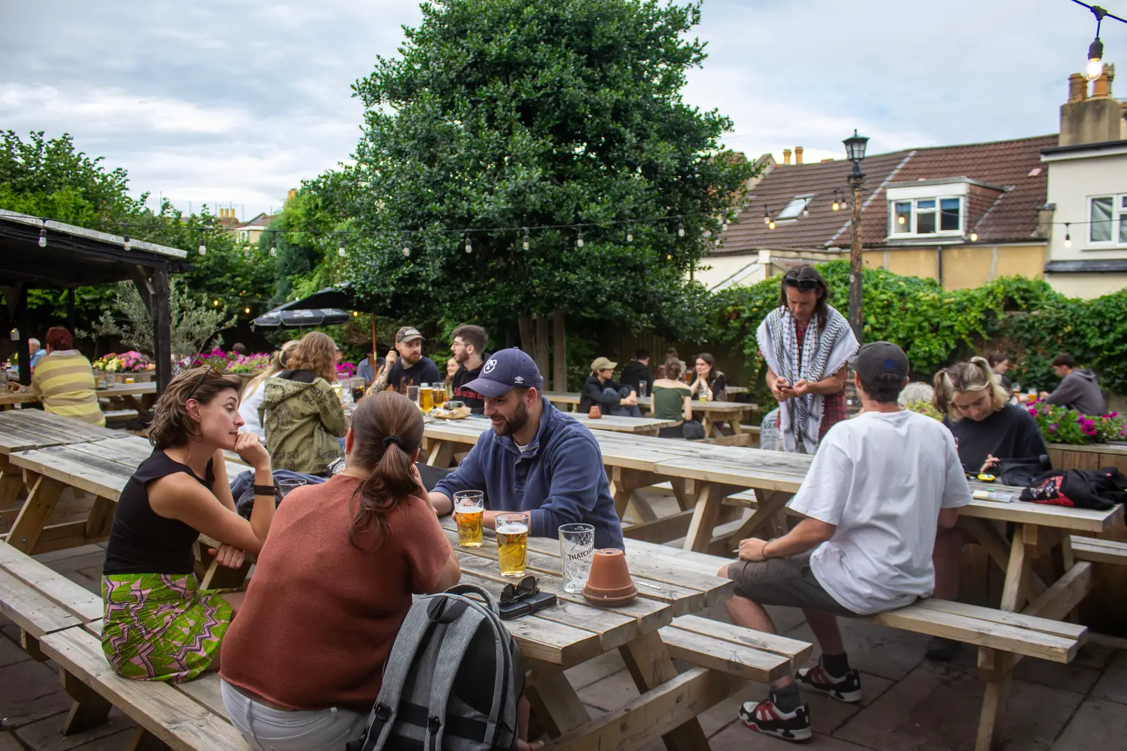 Busy and sunny pub garden in The Cadbury, Montpelier, Bristol. 