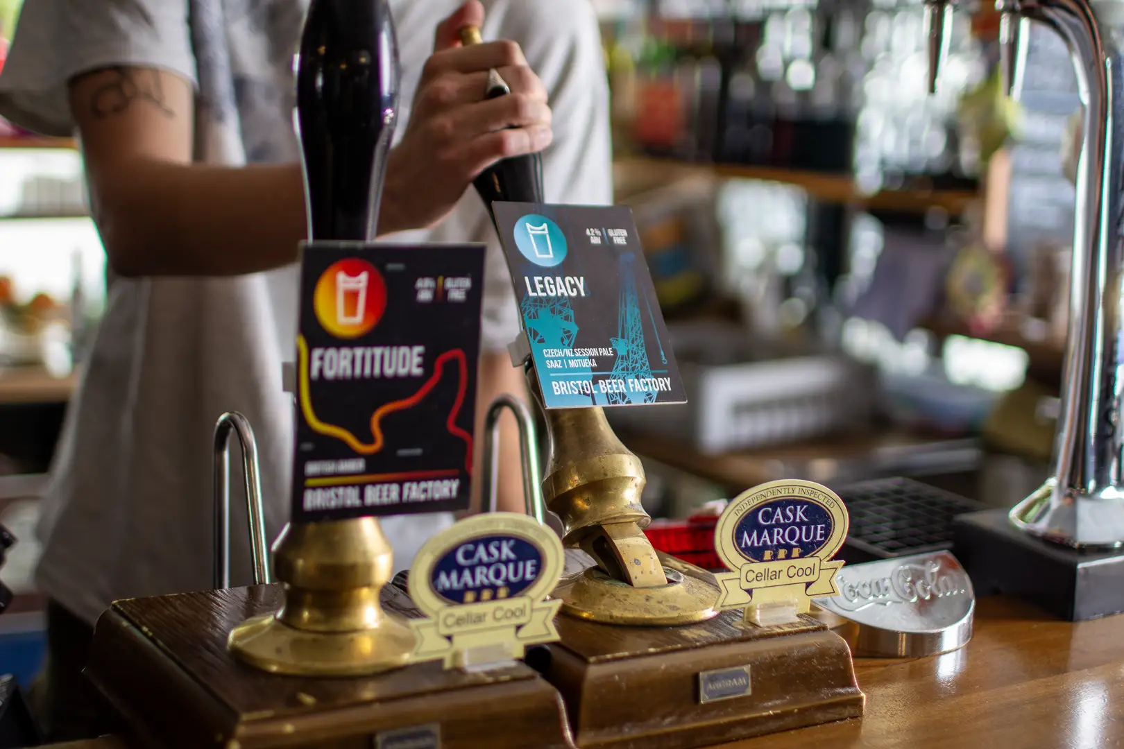 Bartender serving locally sourced Bristol Beer from The Bristol Beer Factory at the Kingsdown Vaults, Kingsdown, Bristol 