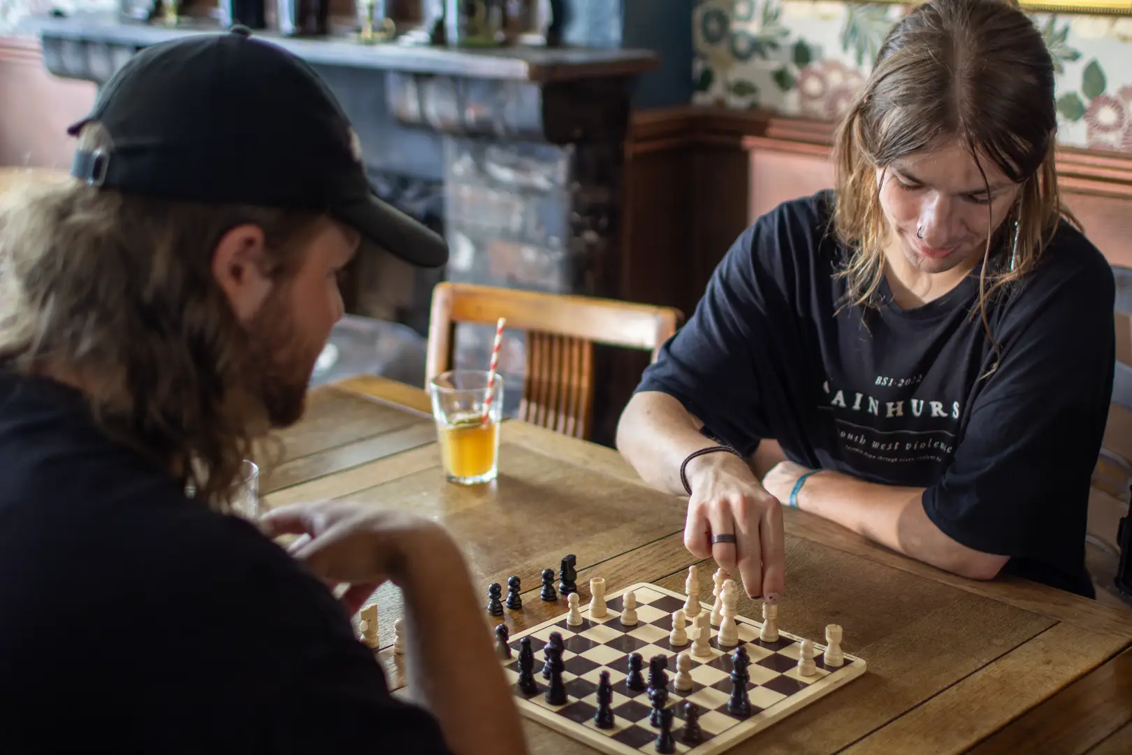 friends playing boardgames and chatting at The Kingsdown Vaults, a central Bristol pub. 