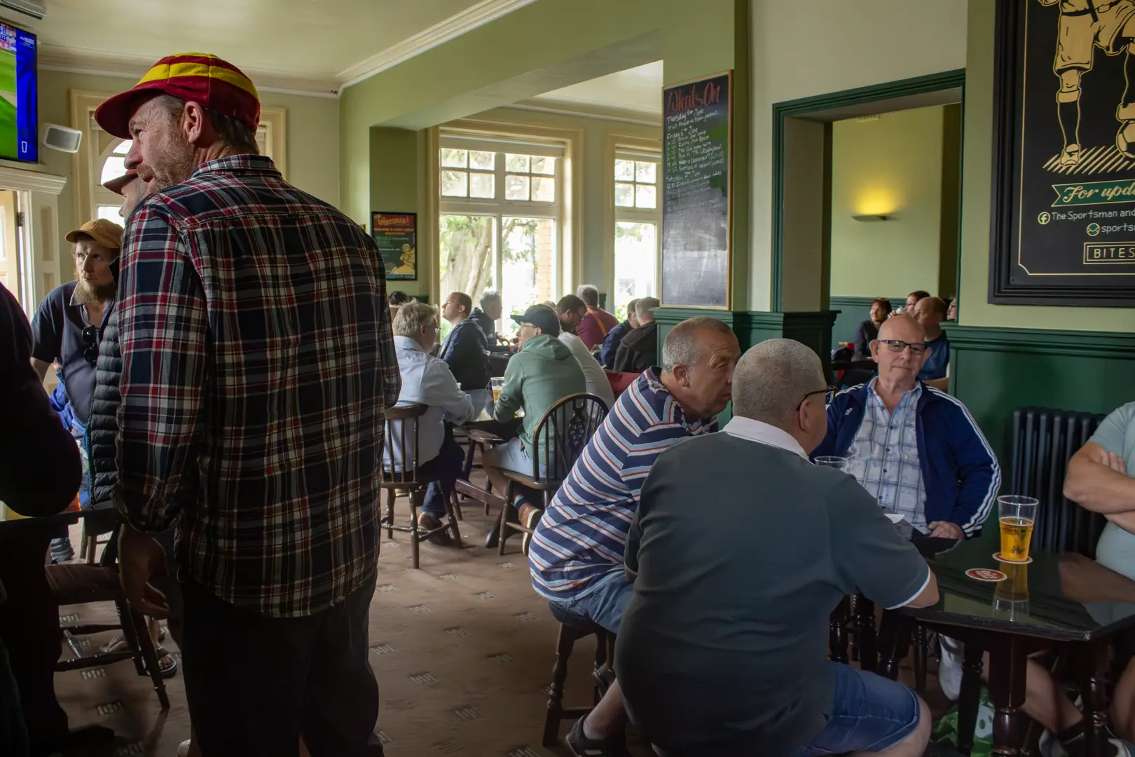 Local sports fans watching the latest live games on our 10 HDR Tv's and catching up over a pint.  
