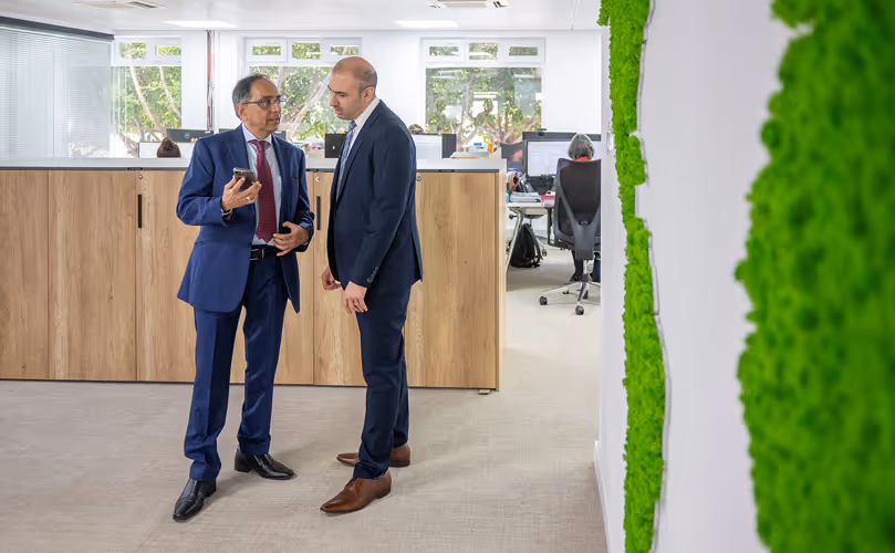 Two people talking at the office