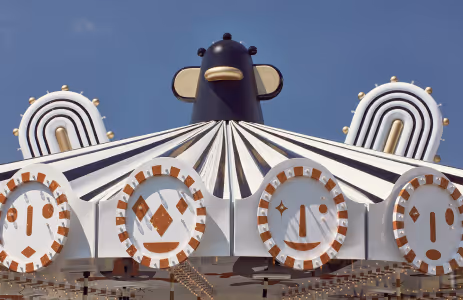 Carousel roof with black and white figure and friendly faces by Jaime Hayon at Swarovski Kristallwelten.