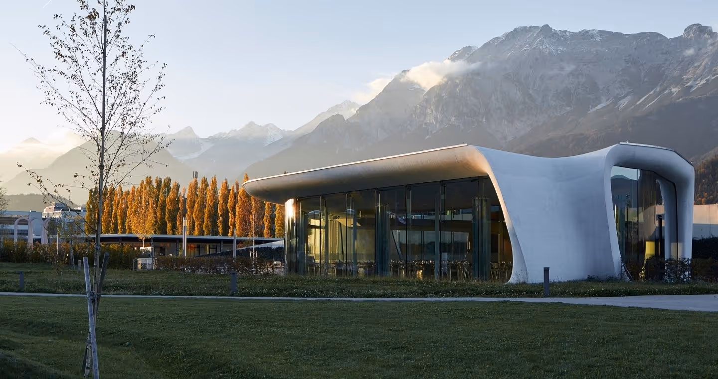 Architecturally impressive Daniels Kristallwelten by DoN restaurant in Wattens, nestled in the Tyrolean mountain landscape.