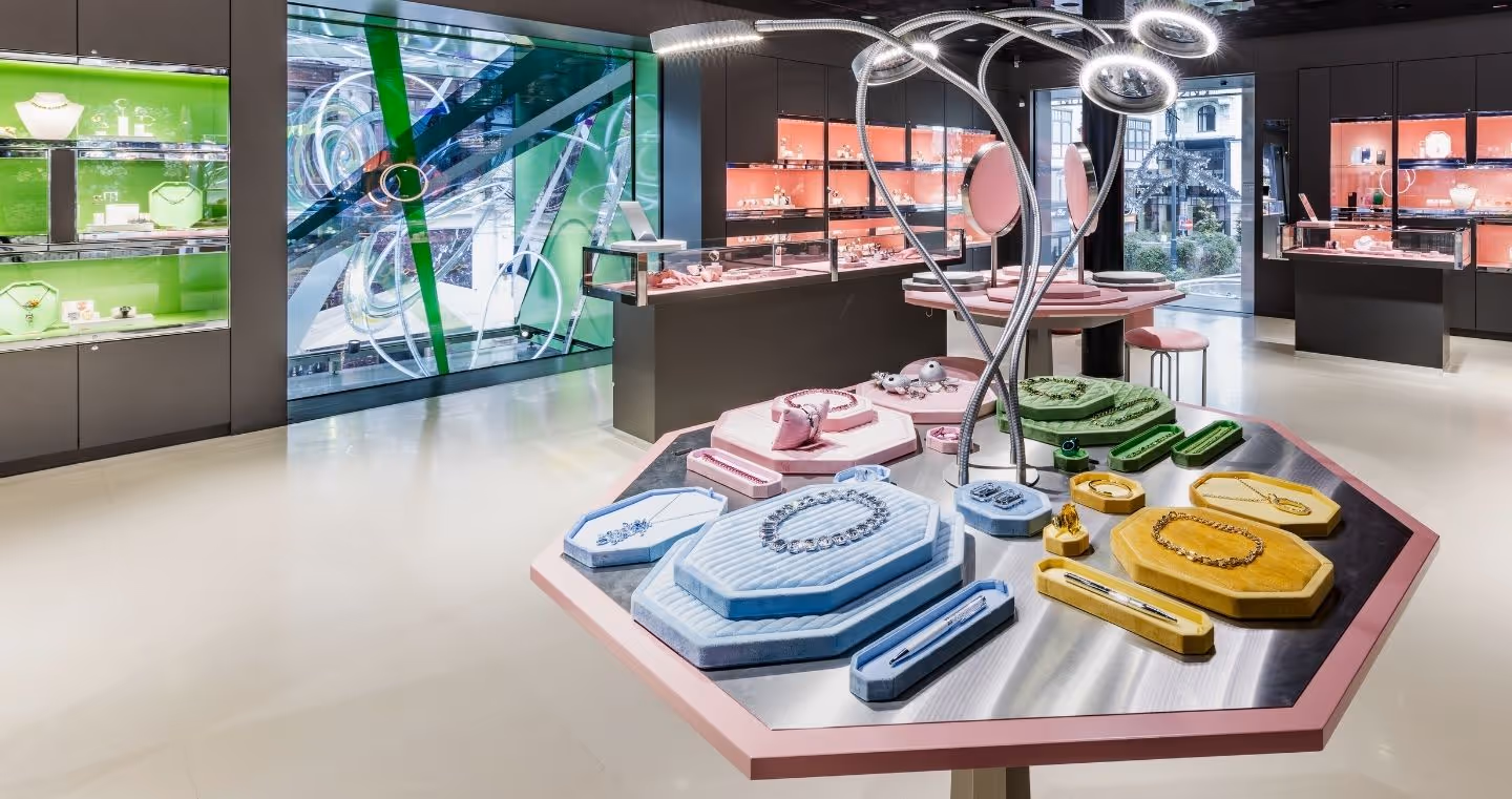 Interior view of the Swarovski Kristallwelten Store Wien with colorful showcases and modern jewelry presentations in pastel color displays.