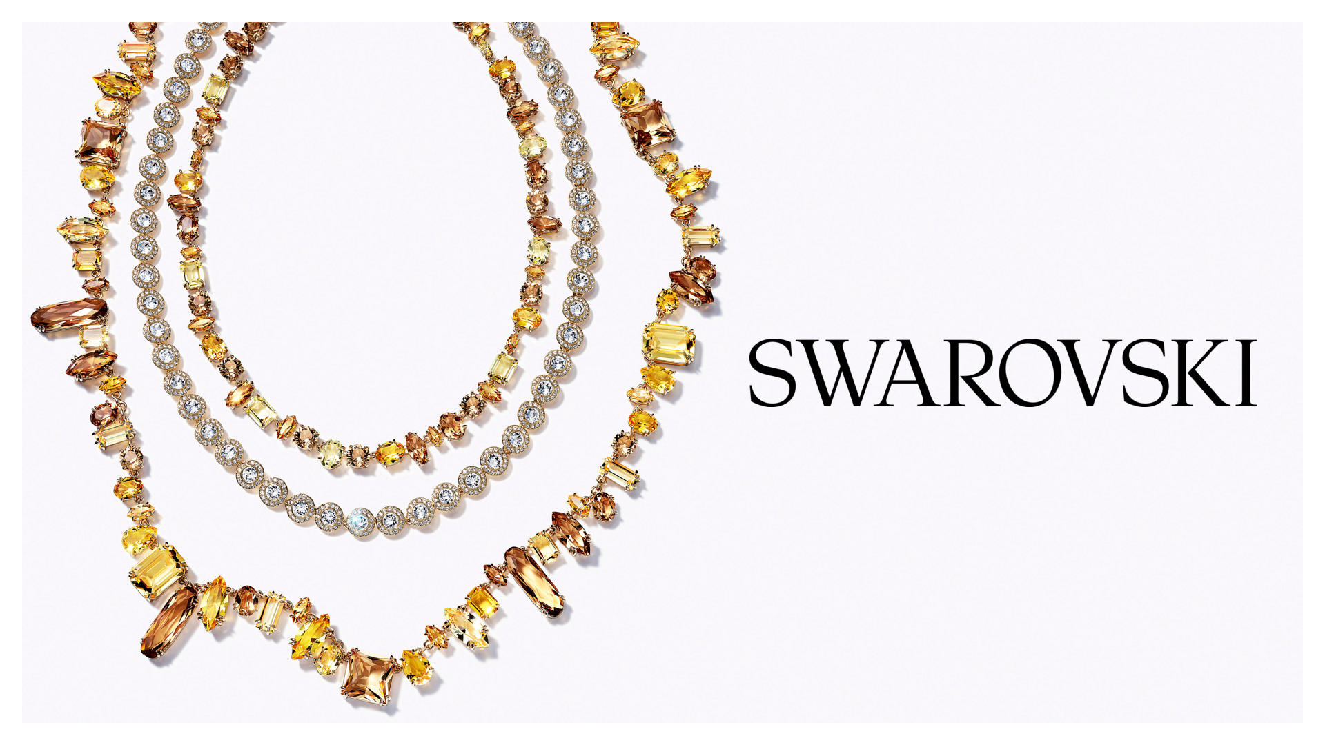 Funkelnde Halskette in Gold- und Bernsteintönen mit Kristallen aus der Swarovski Gema Kollektion.