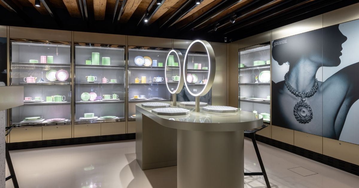 Interior view of the Swarovski Kristallwelten Store Innsbruck with colorful showcases and modern jewelry presentations in pastel color displays.