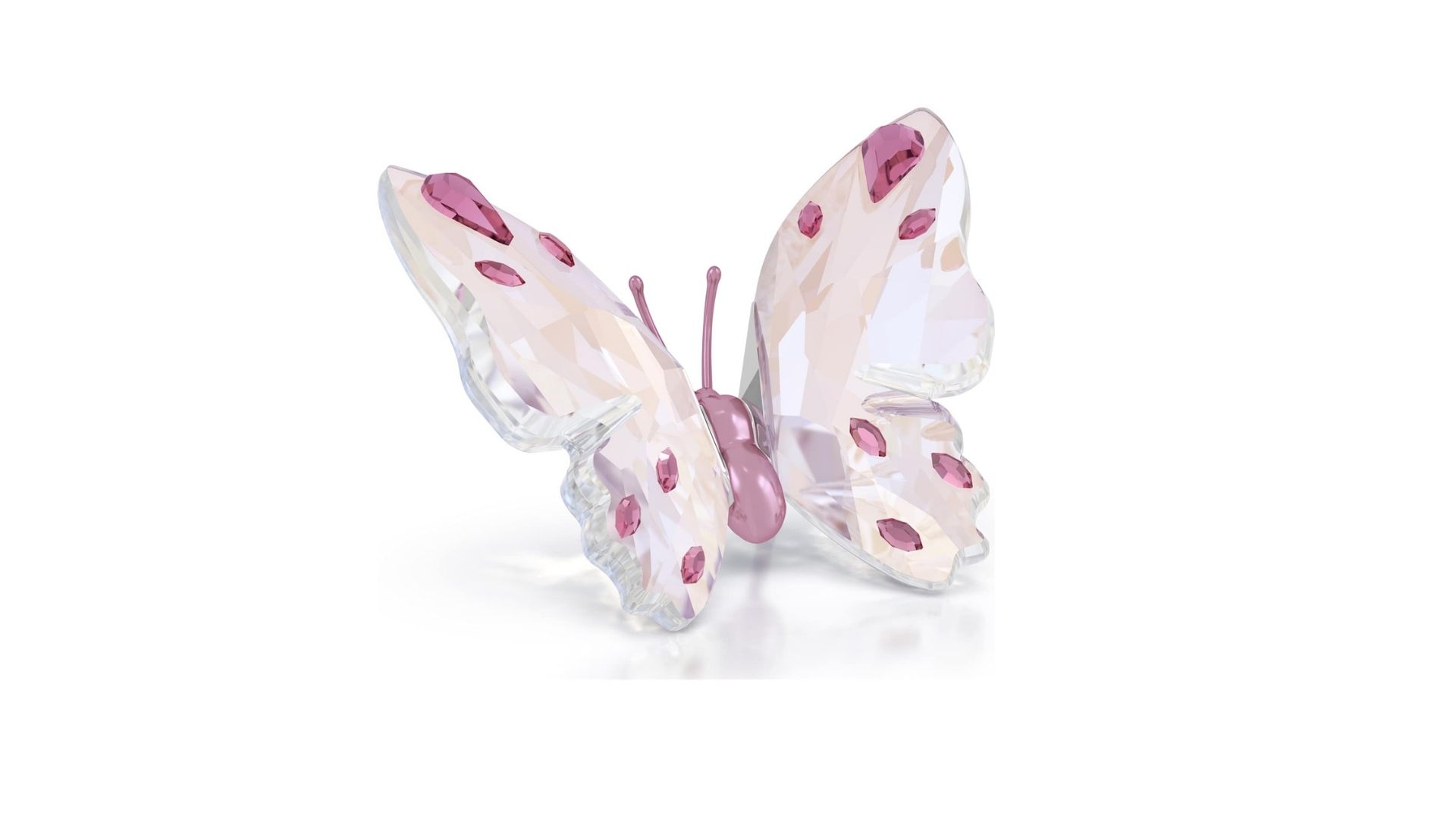 Zarter Swarovski Kristallschmetterling in Rosa- und Fliedertönen mit funkelnden rosafarbenen Kristallakzenten auf den Flügeln.