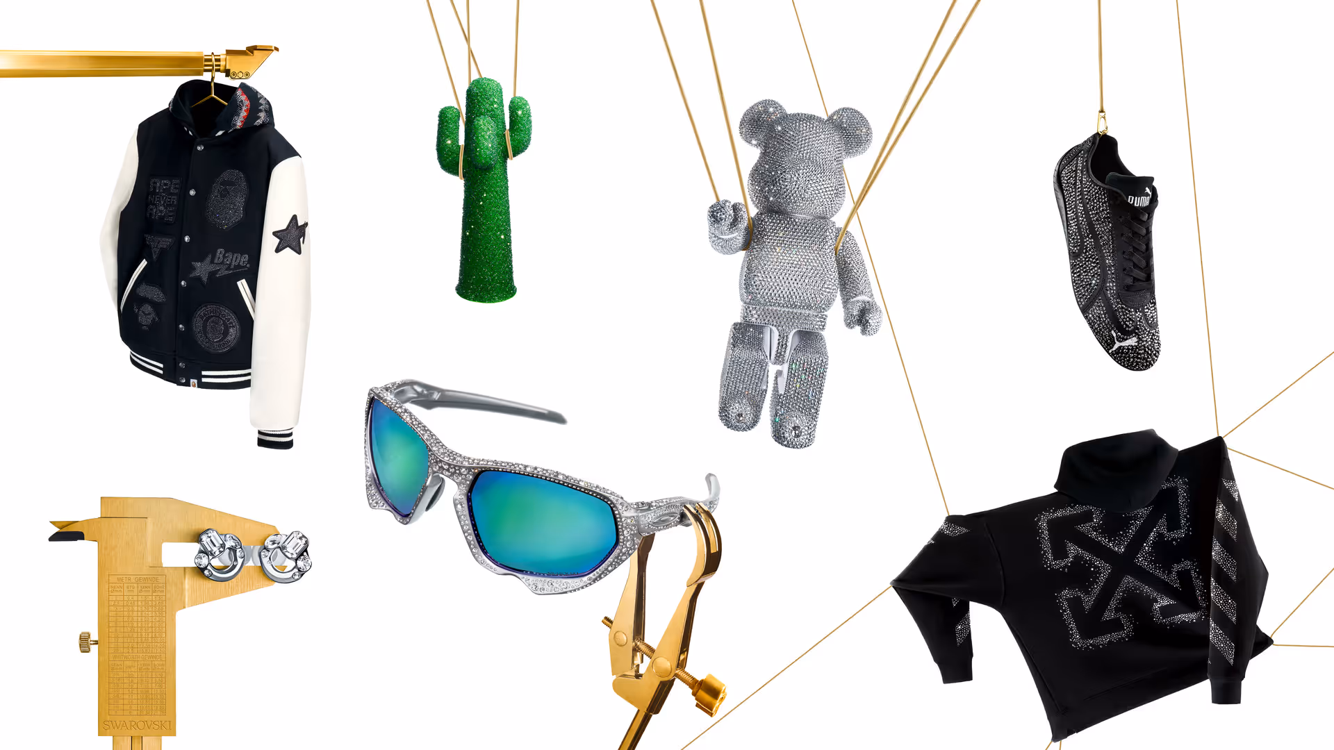 Ikonische Designs und Accessoires globaler Marken, mit funkelnden Swarovski Kristallen besetzt, hängen kunstvoll arrangiert an goldenen Schnüren. Zu entdecken in den Swarovski Kristallwelten Stores.