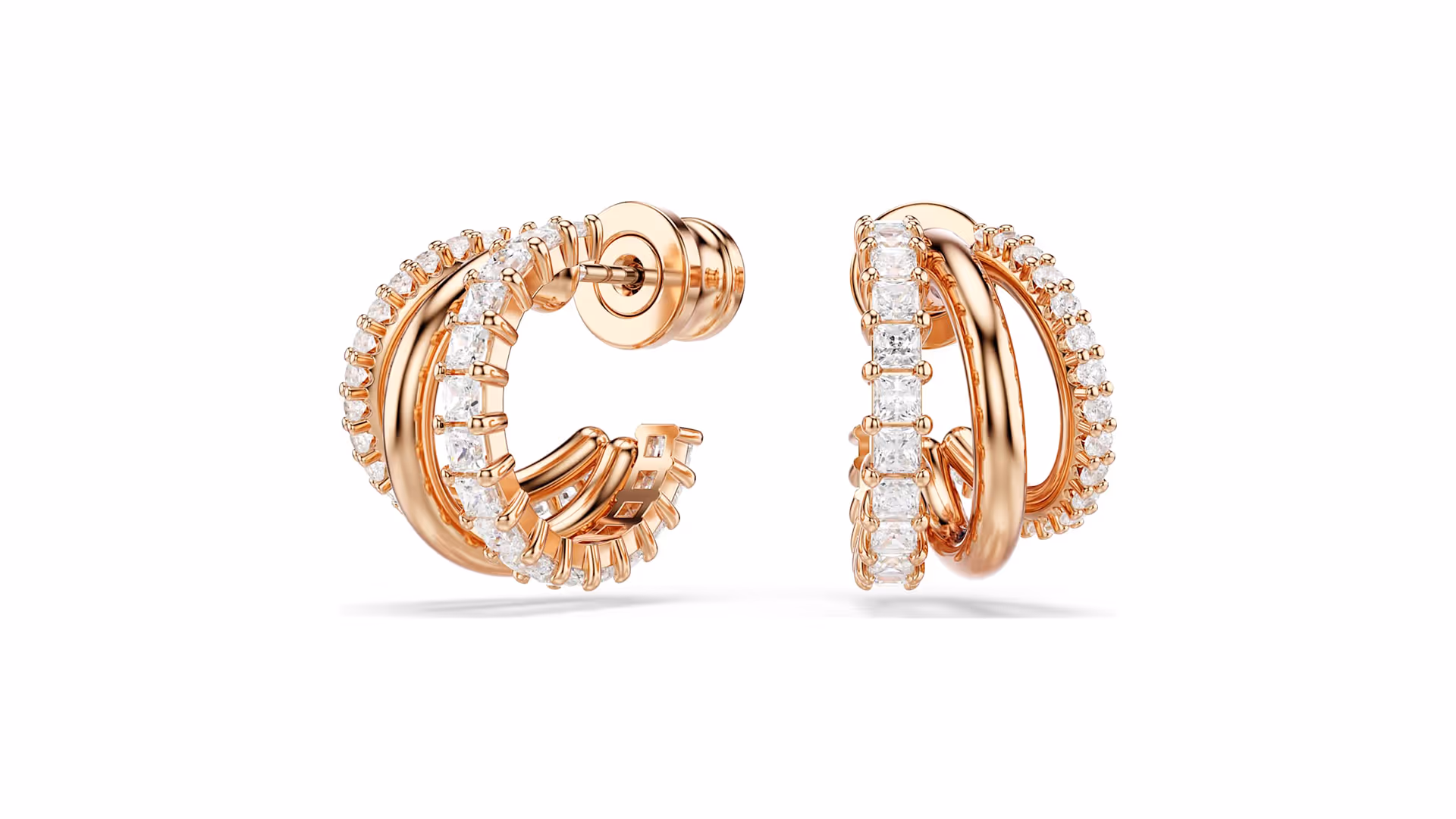 A pair of elegant Swarovski hoop earrings in rose gold, decorated with sparkling white crystals. The multi-layered design gives the earrings a luxurious and modern look.