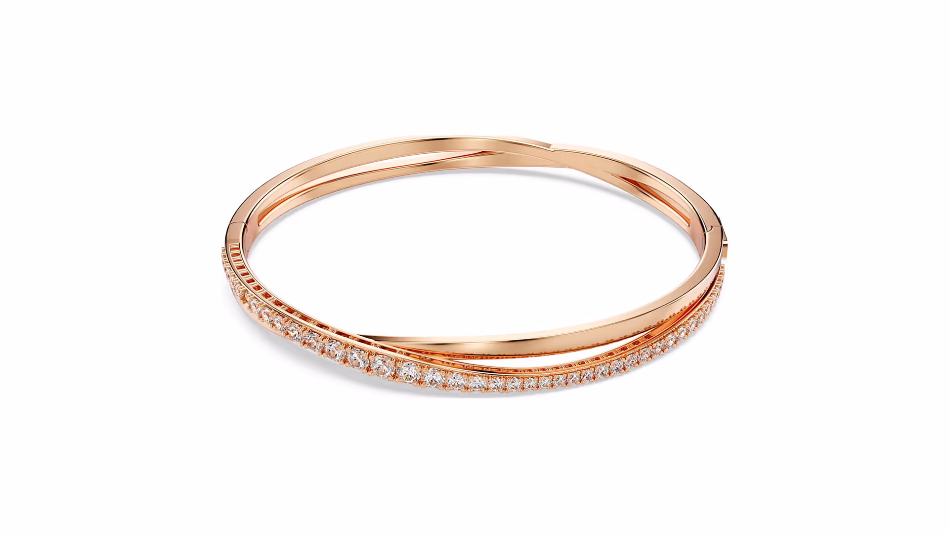 Rose gold Swarovski bangle with two intersecting, slender bows — one of which is set with a dense series of sparkling clear crystals.