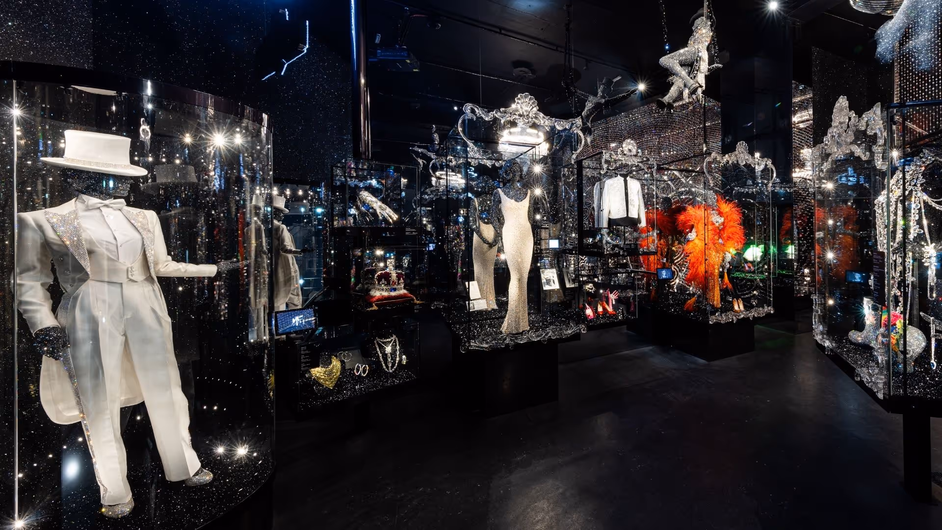 View of the Chamber of Wonder “The Art of Performance” at Swarovski Kristallwelten with glass showcases and sparkling stage costumes by international artists.