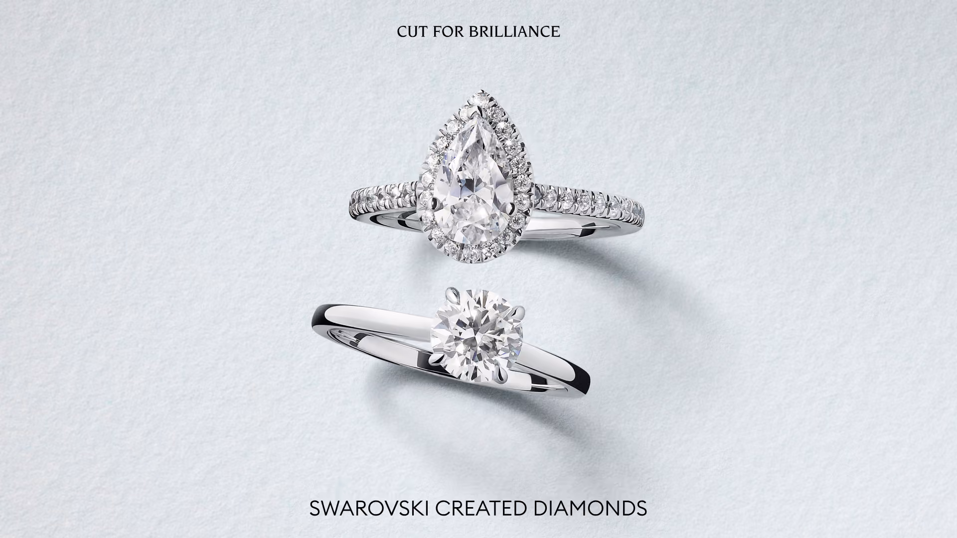 Two Swarovski Created Diamonds rings made of silver, against a light background with the words “Cut for Brilliance.”