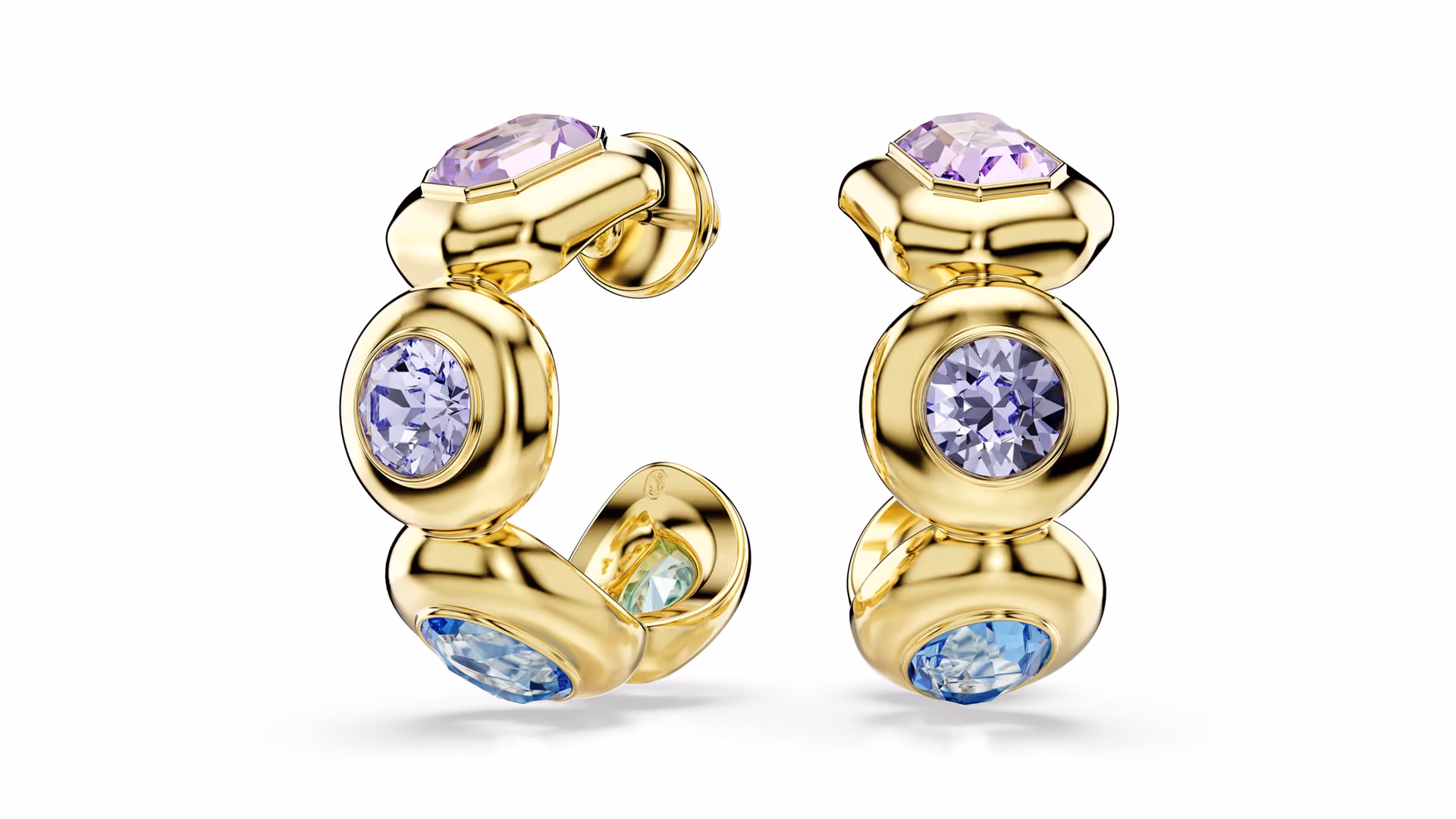 Swarovski earrings with large, colorful crystals, presented in a minimalistic way against a light background.
