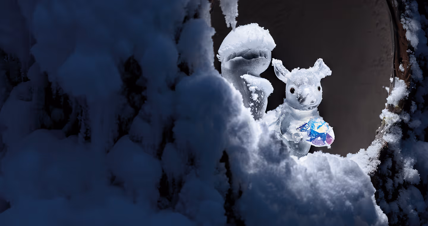 A snowy squirrel sits in a snow-covered tree cave in the Chamber of Wonder Silent Light at Swarovski Kristallwelten.
