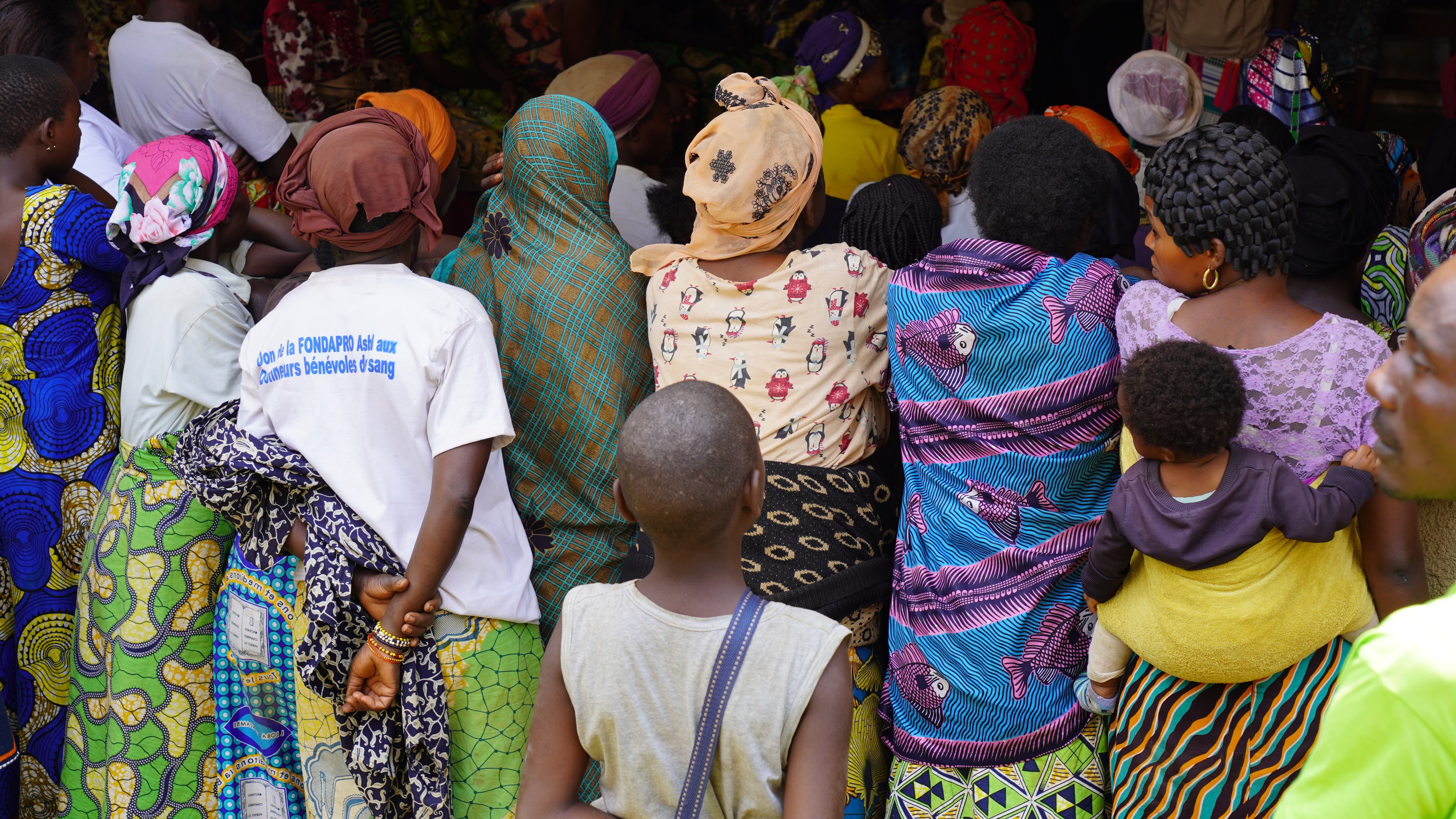 Women standing with their backs to us