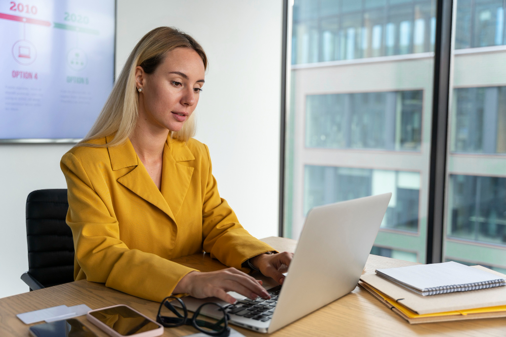 woman typing on a laptop - AI Workflows 