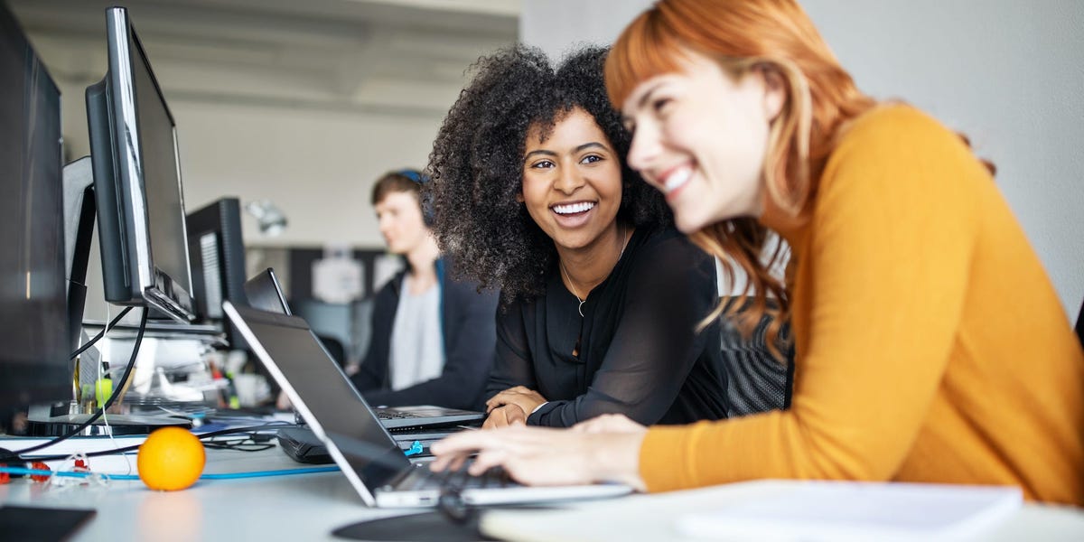 women laughing - AI Lead Nurturing