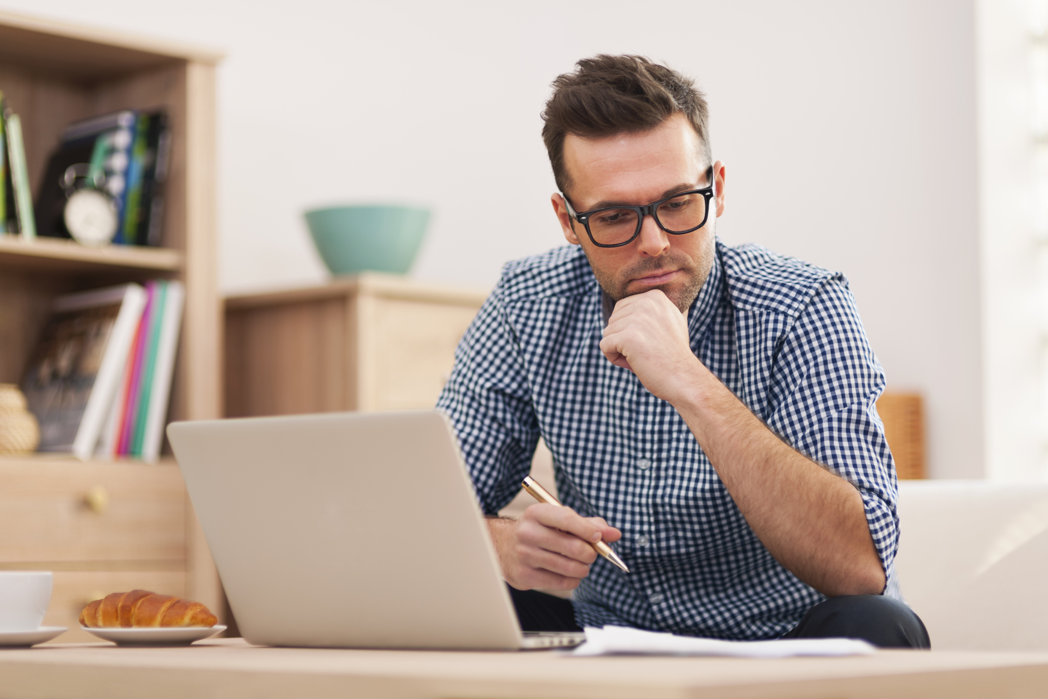 man using a laptop - Best AI Market Research Tools