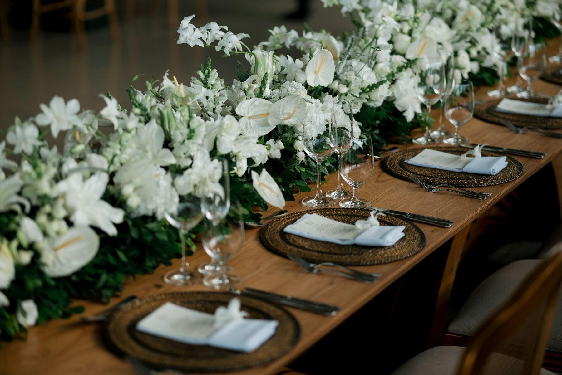 An elegant wedding table arranged with flowers and place settings