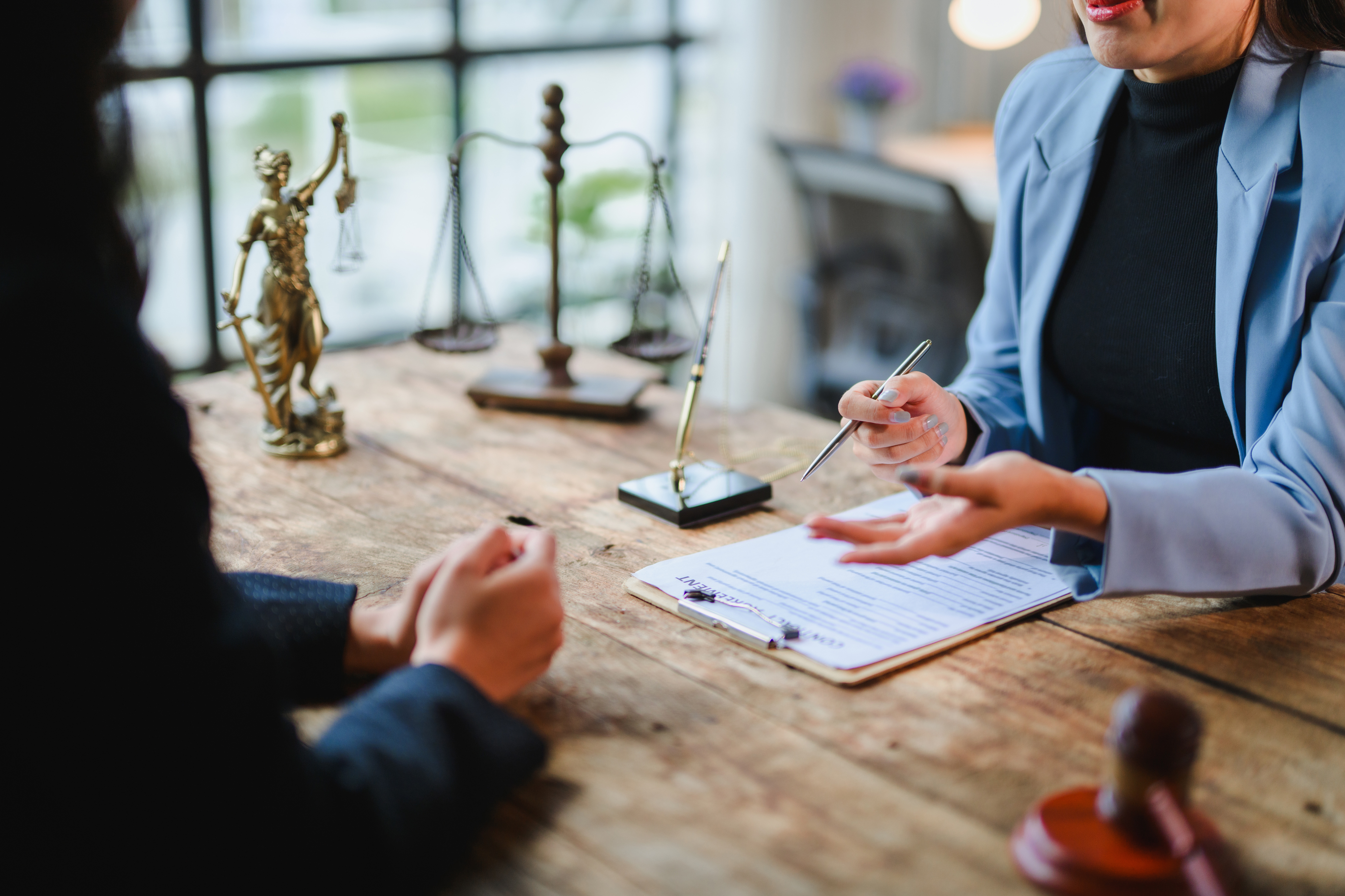 Florida homeowner reviewing property damage insurance claim paperwork with attorney