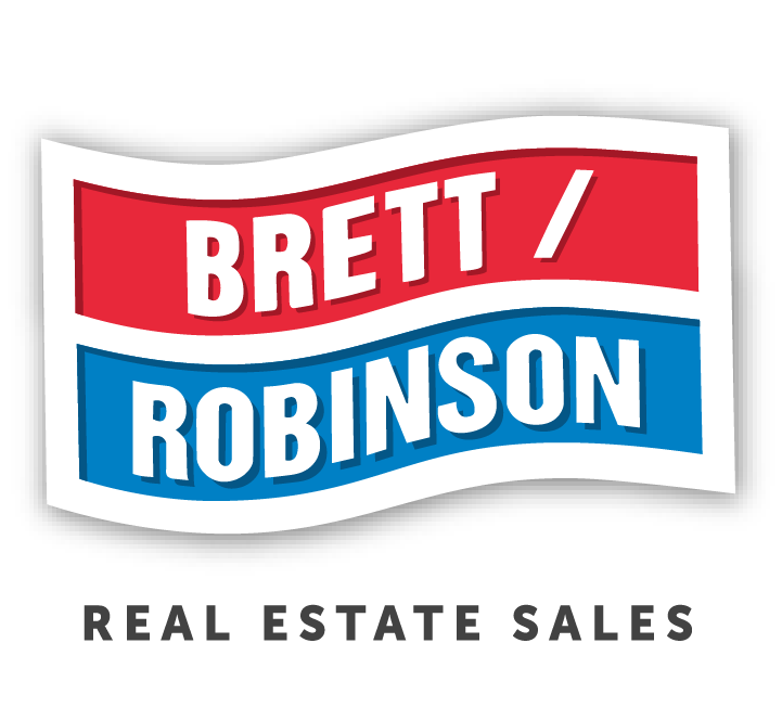 EXIT logo with stylized house roofs beneath the bold uppercase letters.