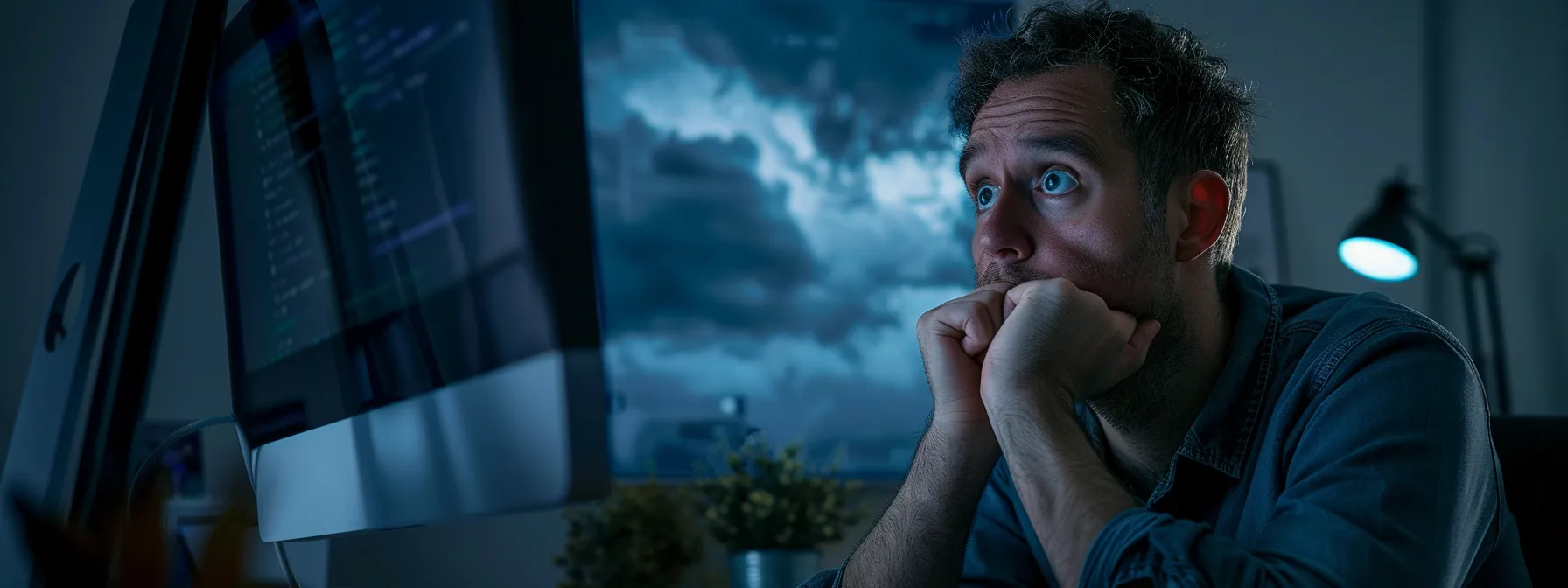 a person looking at a computer screen displaying their email server status with a worried expression, surrounded by dark storm clouds symbolizing service outages.