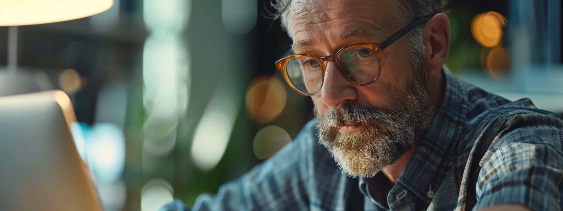 a focused individual with a notepad, listening attentively to a microsoft support representative on a call.