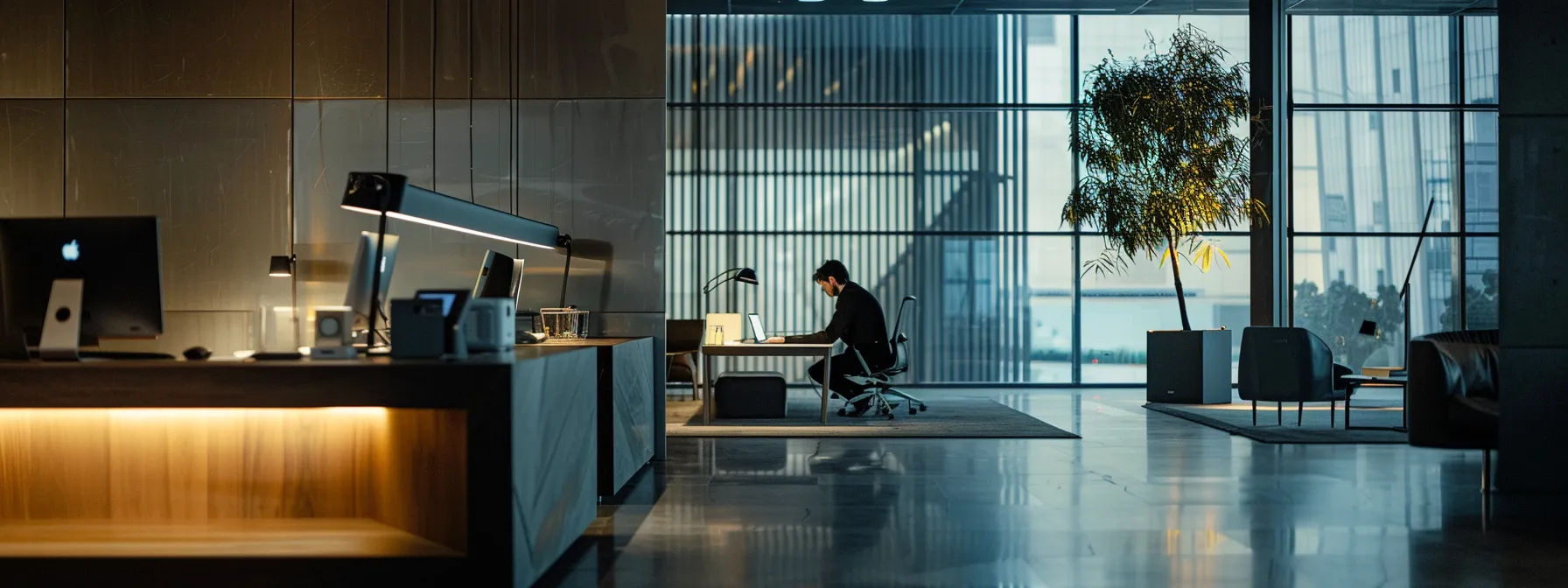 a user holding down the 'option' key while restarting their mac, selecting the recovery mode disk in a sleek, modern office setting.