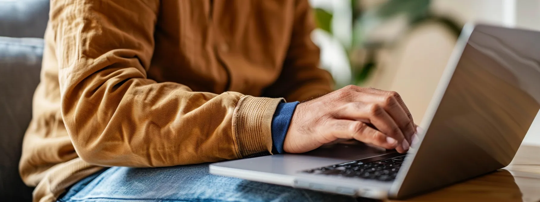 a person holding a macbook pro while pressing a combination of option, command, p, and r keys to reset nvram and pram.