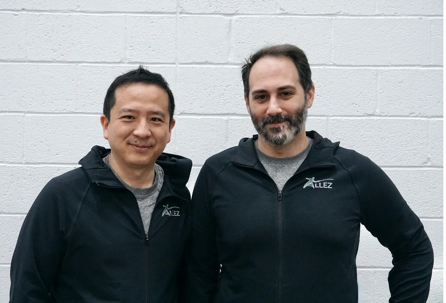 Founders of Allez Fencing Club in Watertown, MA, standing together in club apparel, representing the leadership and community behind the club’s mission.