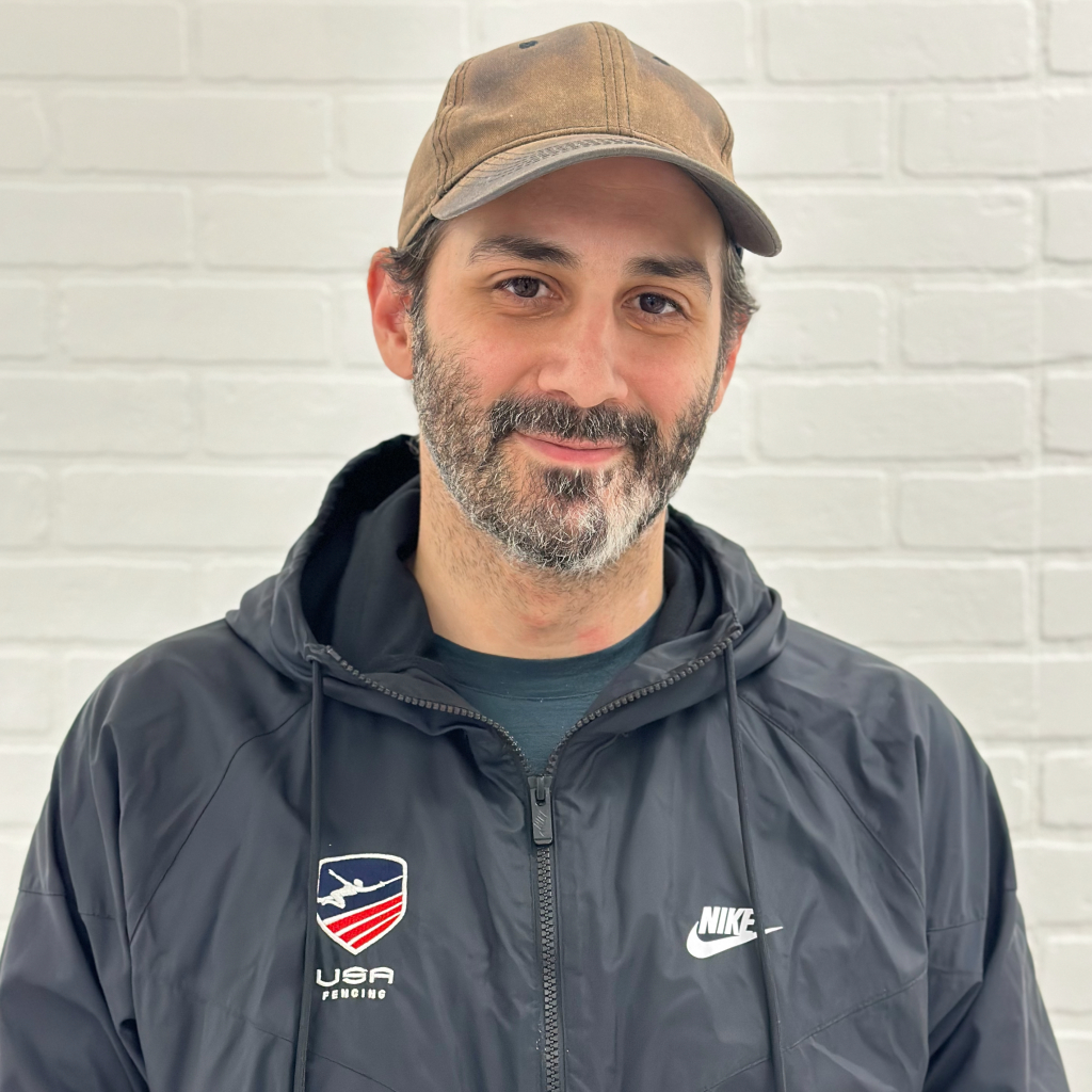 Experienced épée coach Mark Elbag, instructor at Allez Fencing Club in Watertown, MA, with over 20 years of coaching  youth and adult fencers.