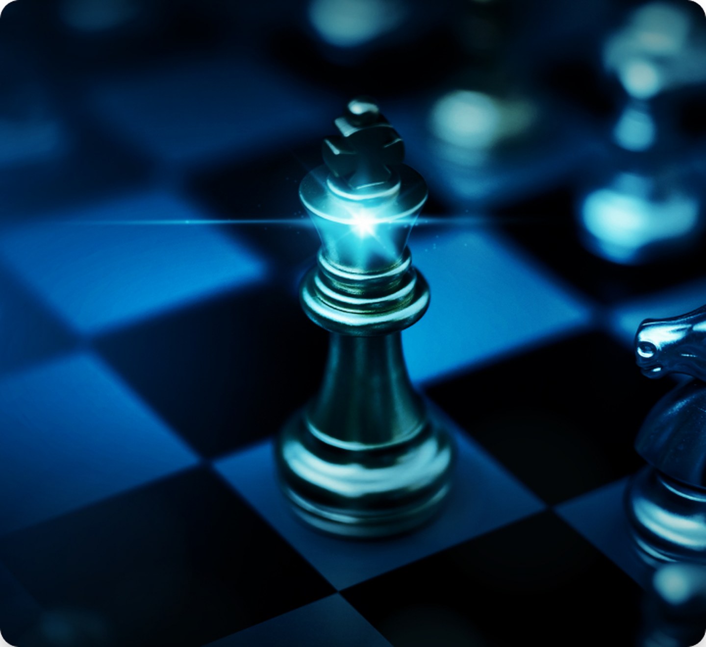 A chess king lit against a board, representing strategic positioning