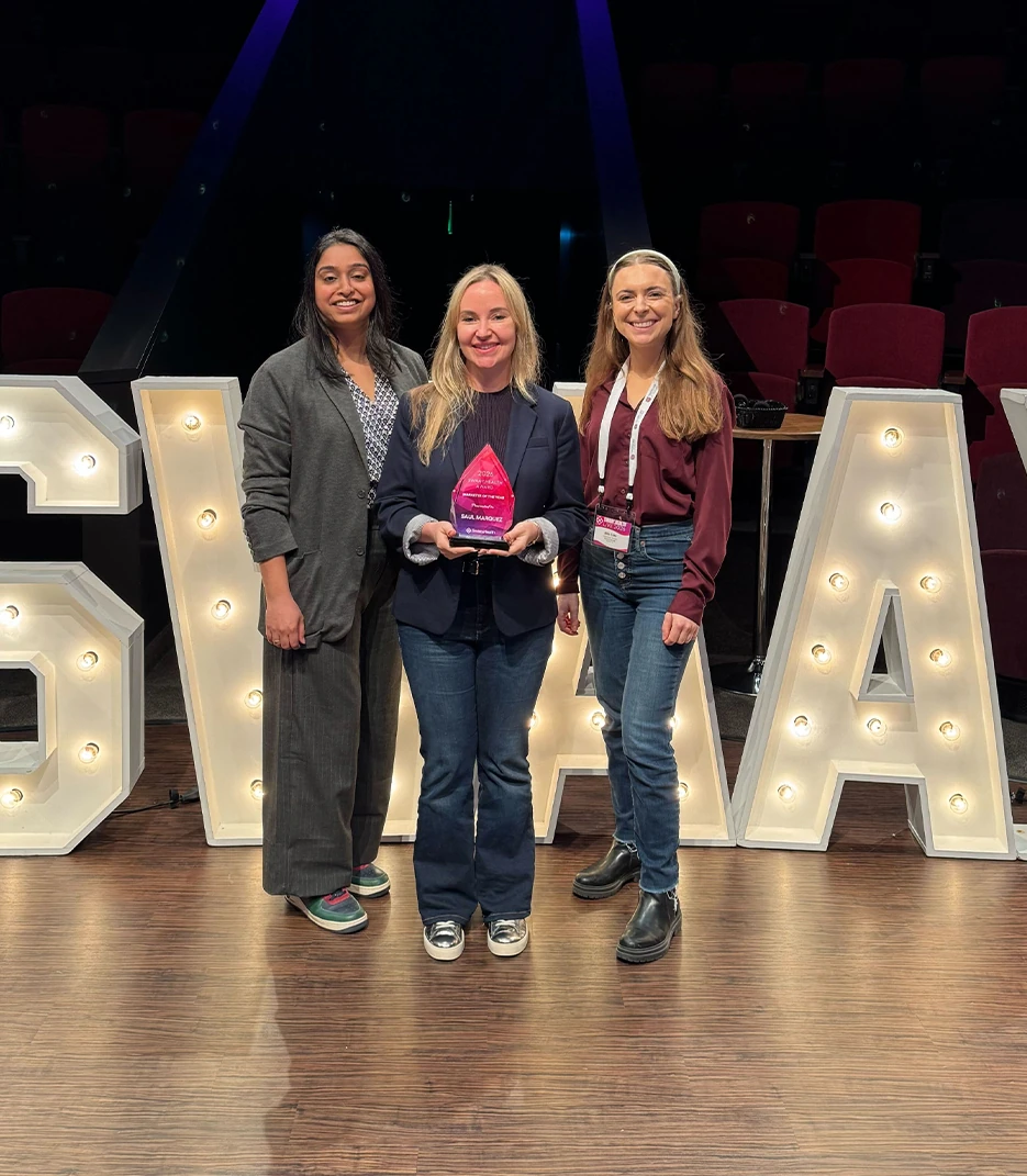 Outcomes Rocket team accepting the Swaay.Health 2026 Healthcare Marketer of the Year award on stage
