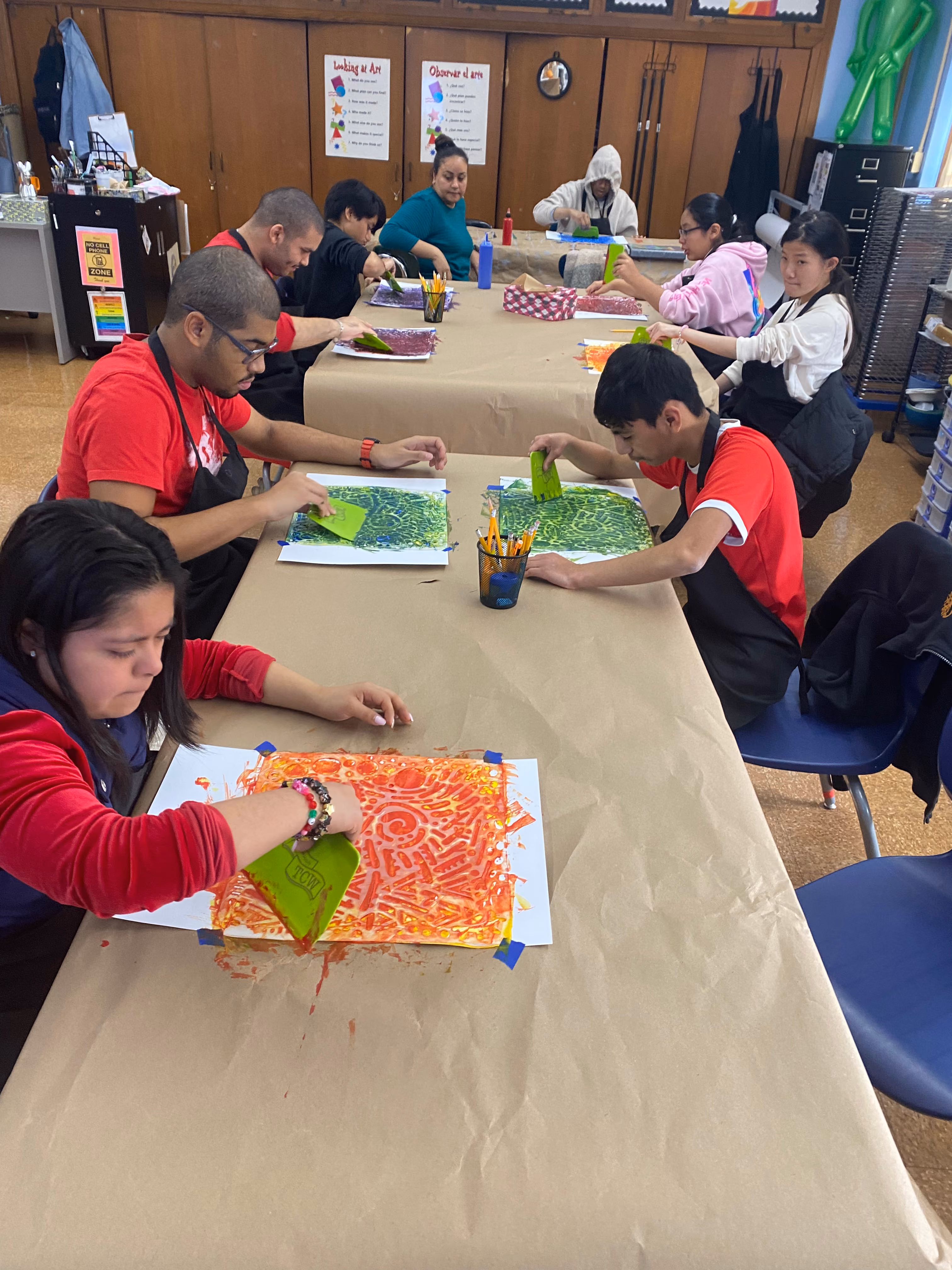 Students creating colorful painting projects in art class