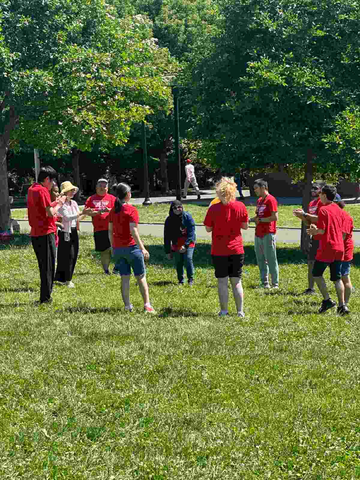 Students sitting outdoors together during a school field trip