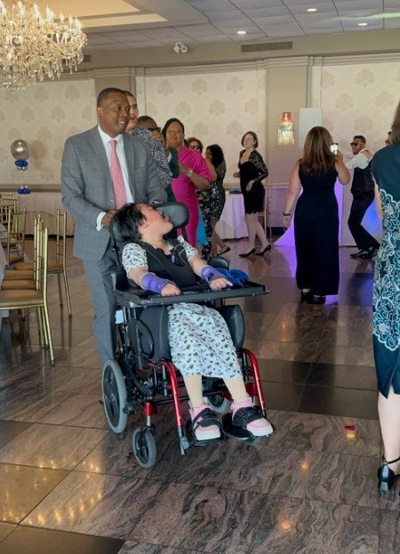 Student in wheelchair attending a formal school dance event