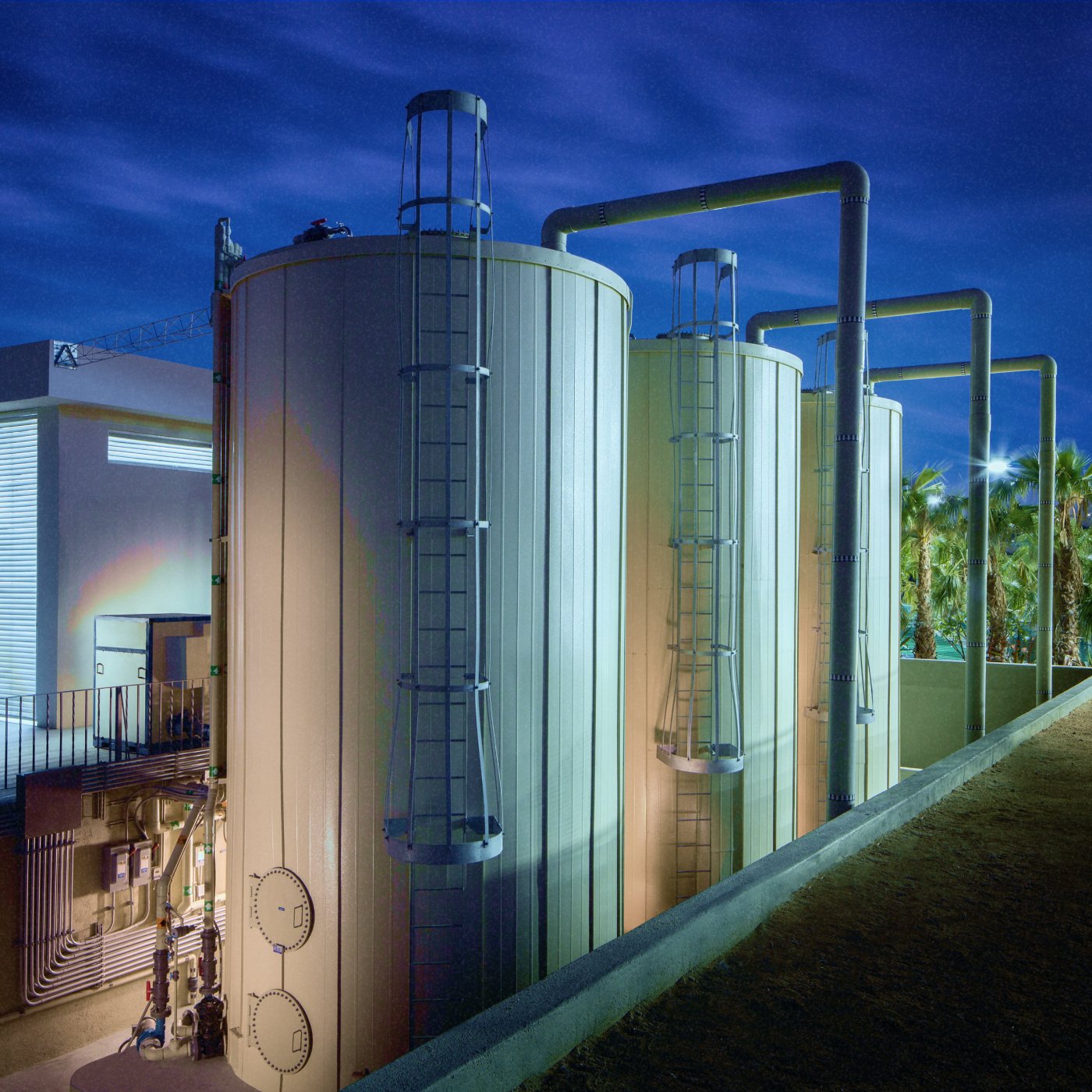 Man in hard hat checking out a water treatment facility 