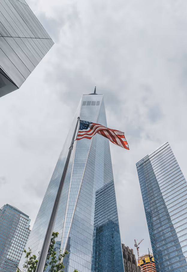USA flag with skyscraper in the background
