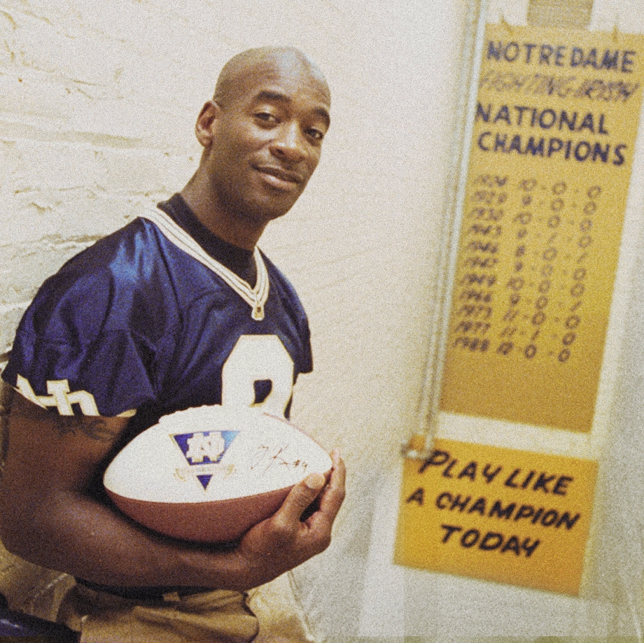 Tony Rice at Notre Dame by "Play like a champion today" sign
