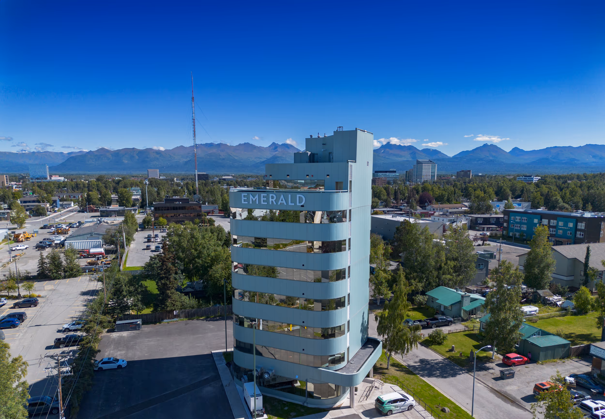 The Emerald building with the city of Anchorage, AK in the background. 