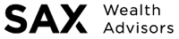 A black and white photo of a clock in the dark.