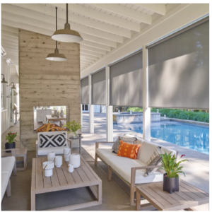 Roller shades on a patio with a view of the swimming pool 