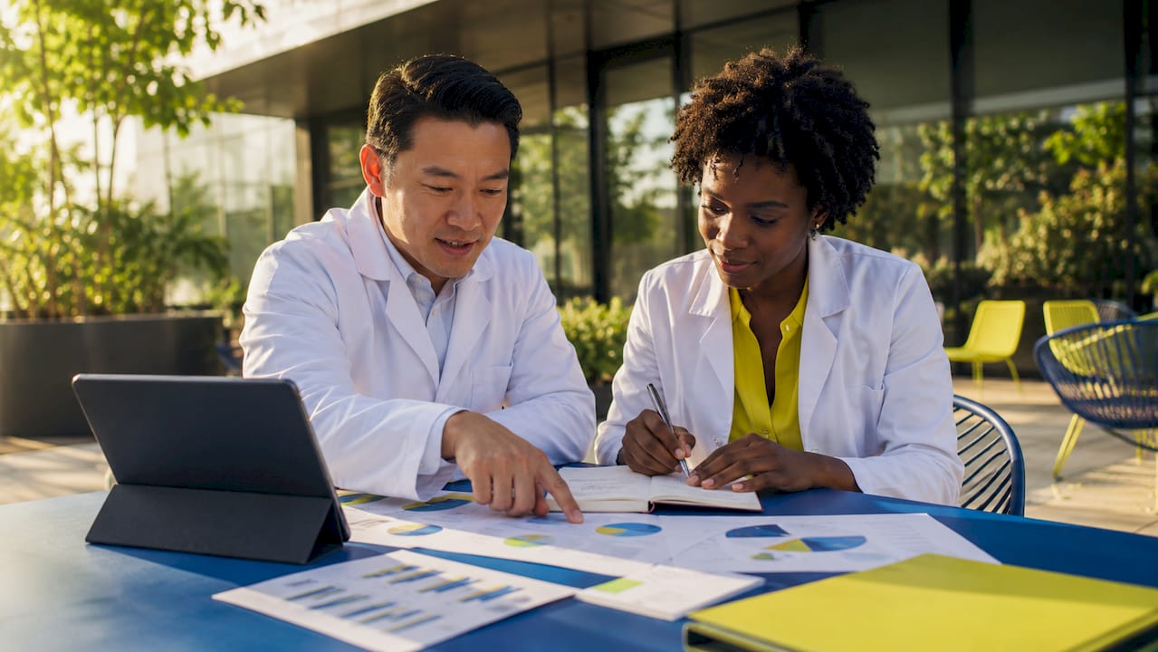 Medical professionals collaborating on marketing plans