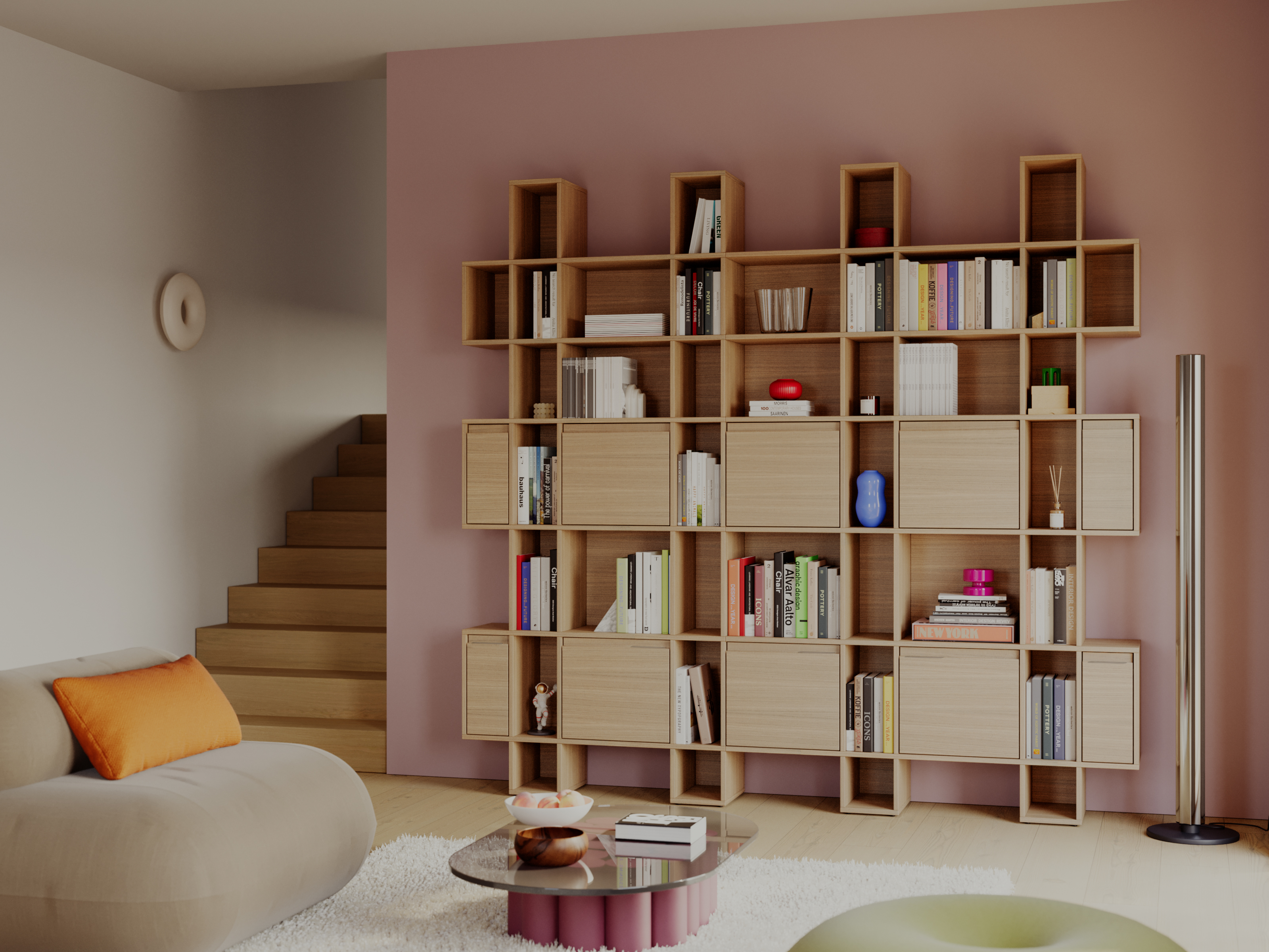 Wooden oak veneer wall-mounted bookcase in a living room with a pink accent wall