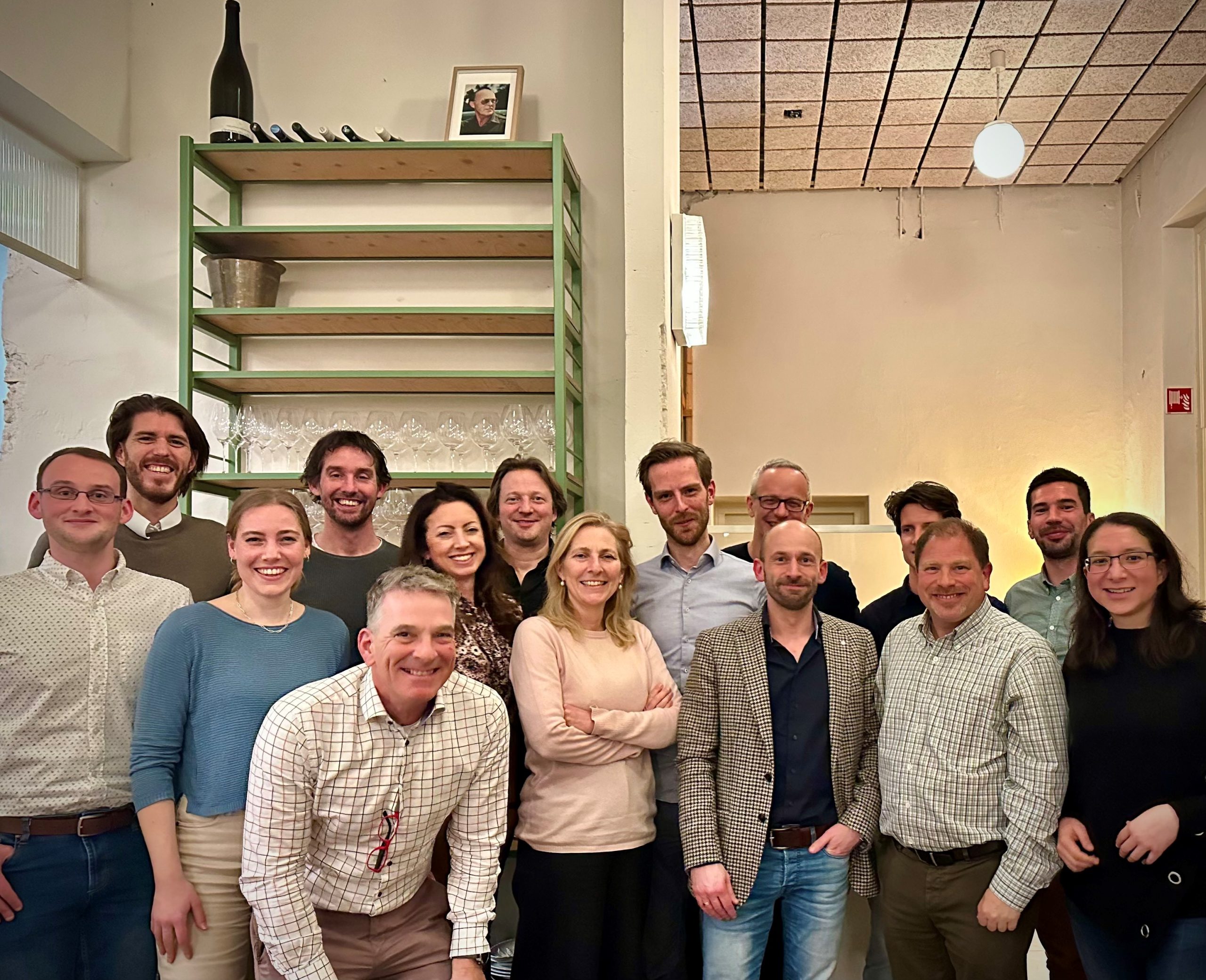 Group of people posing together at a closing dinner event