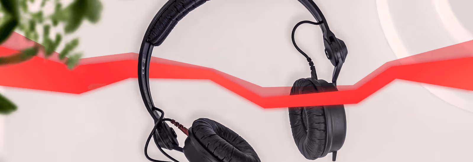 Headphones with a string of red data running through them.