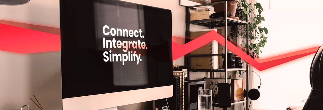 Modern workplace with desktop computer, on the “Connect. Integrate. Simplify.” is displayed — Theobald Software office equipment.