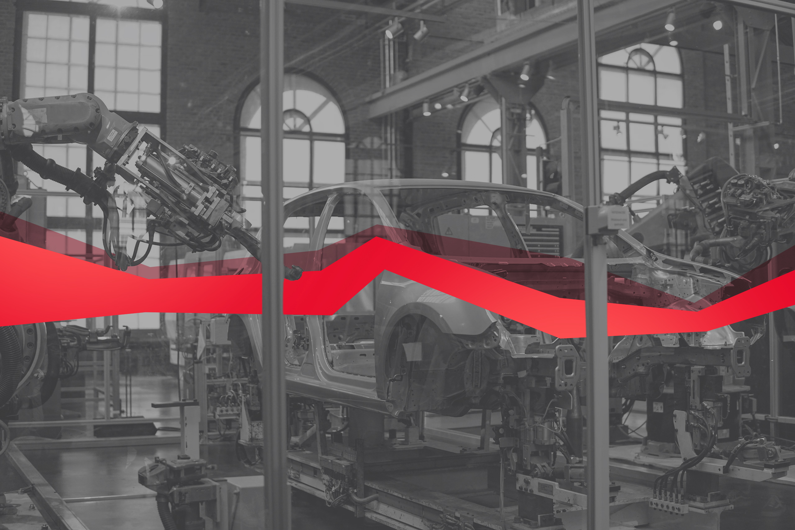 Black and white image of a workshop with a car built by robots, with a string of red data.