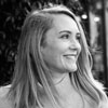 A black and white portrait of the author, Megan Tatum.