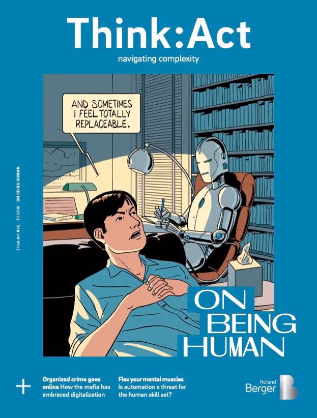 Think:Act Magazine cover with a teal blue background and a large, centered cartoon of a human in the foreground and a robot sitting at a desk on an office chair in the background, turned towards the human. Speech bubble top-left shows “and sometimes I feel totally replaceable.”